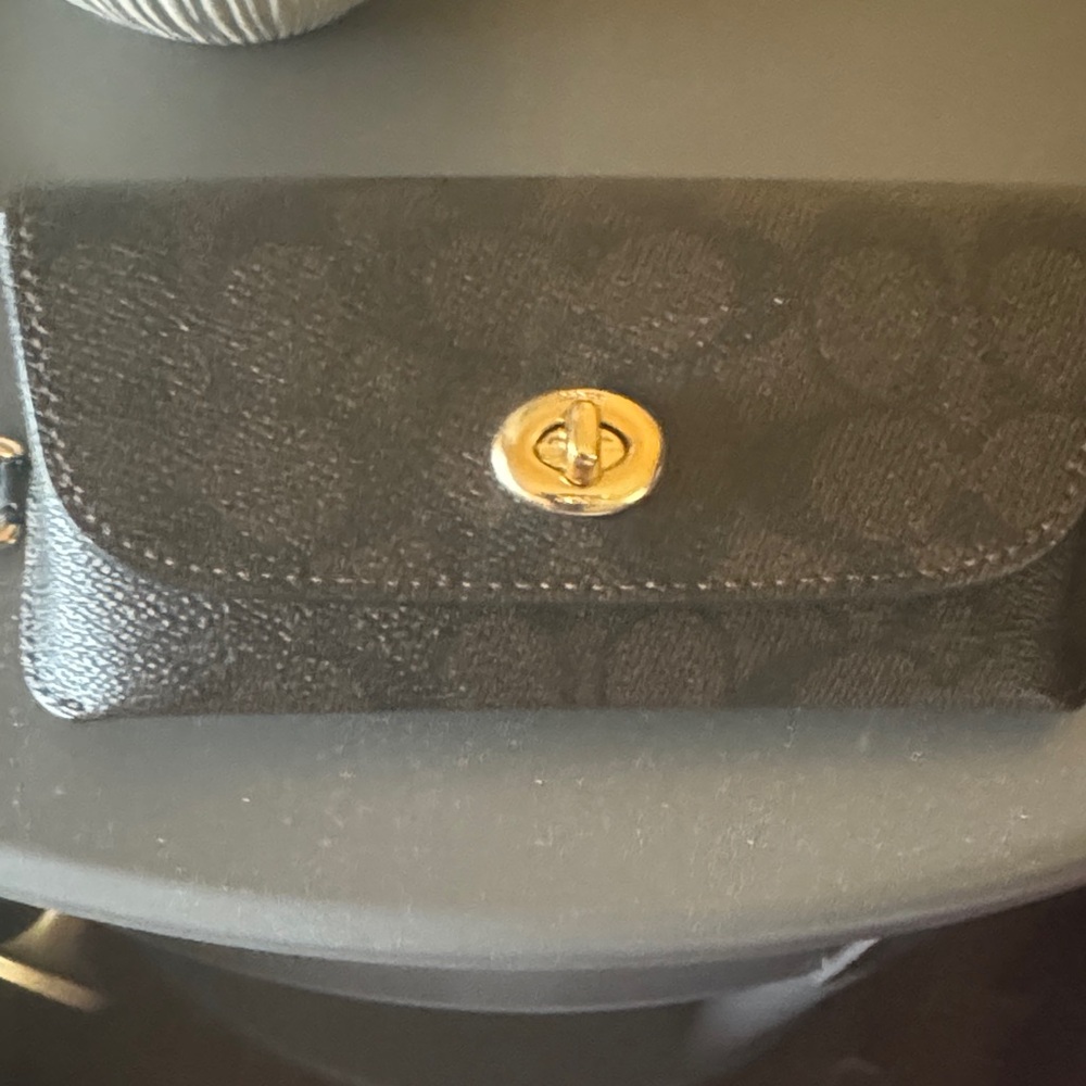 Black and brown coach sunglasses case